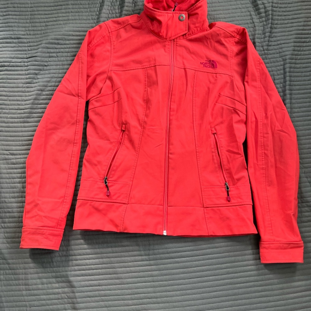 The North Face women orange  jacket; size small petite.